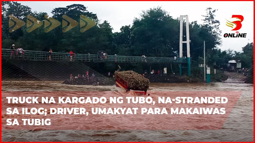 ⁣Truck na kargado ng tubo, na-stranded sa ilog; driver, umakyat para makaiwas sa tubig